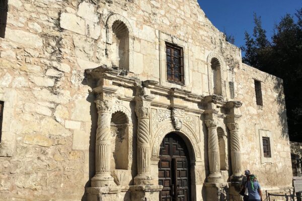 facade of ancient roman catholic church on sunny day