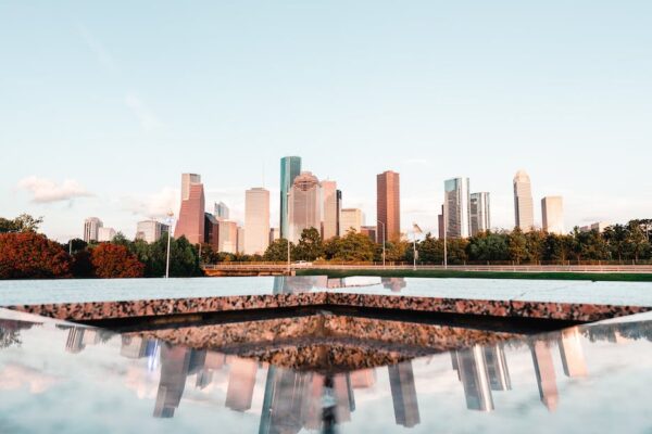 the reflection of the city skyline on the houston police officer s memorial